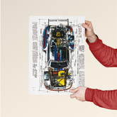 Person holding Porsche 935 Turbo blueprint poster by Dripster showing detailed car technical drawing
